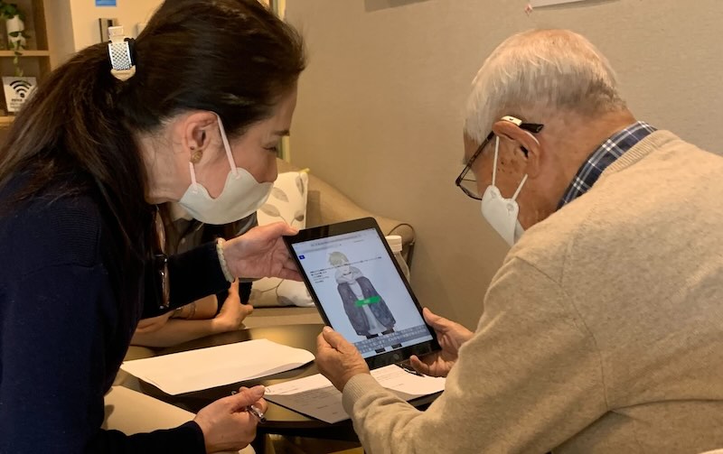 Resident and staff with the avatar companion at Wellis Olive Senrioka