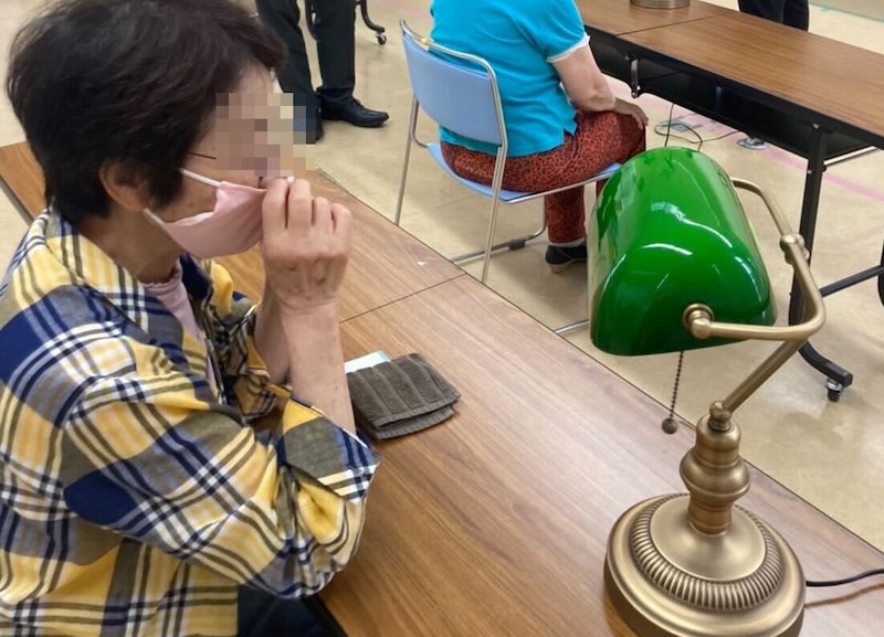 Elderly resident interacting with the voice companion lamp device